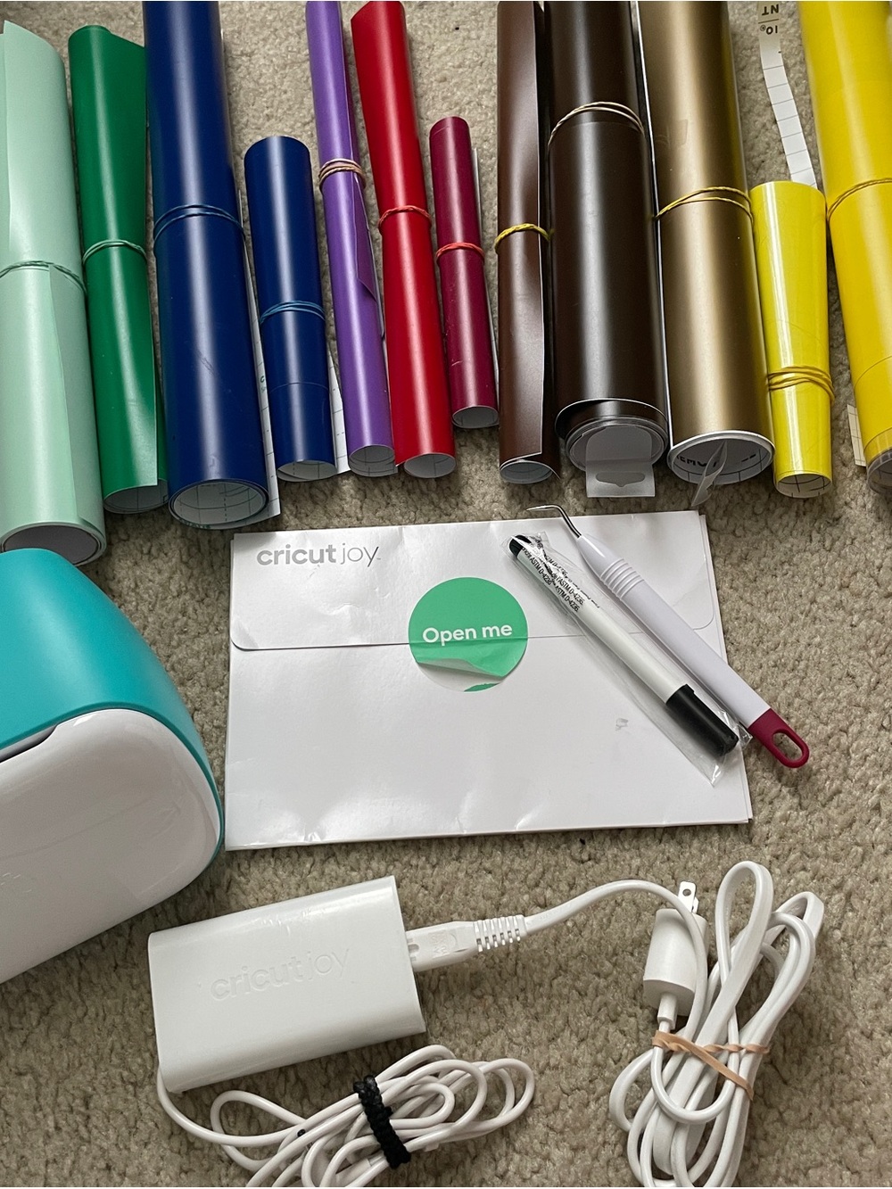 Cricut Joy with Assorted Colorful Vinyl Rolls and Tools